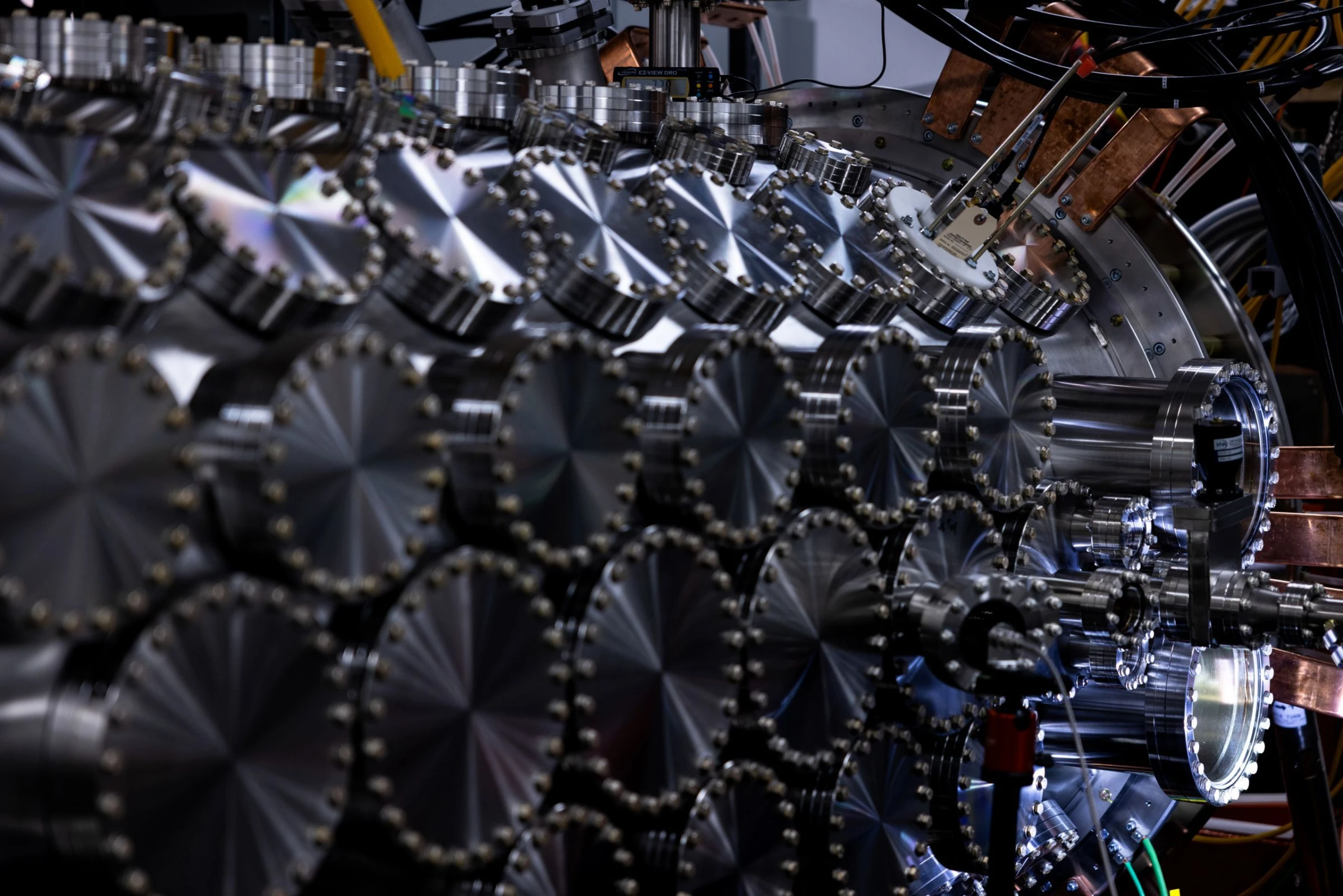 fusion device in industrial setting, large metallic cylinder