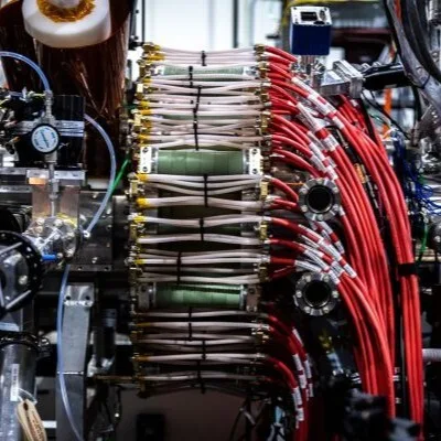 A whole bunch of wires running in a ring around a chamber